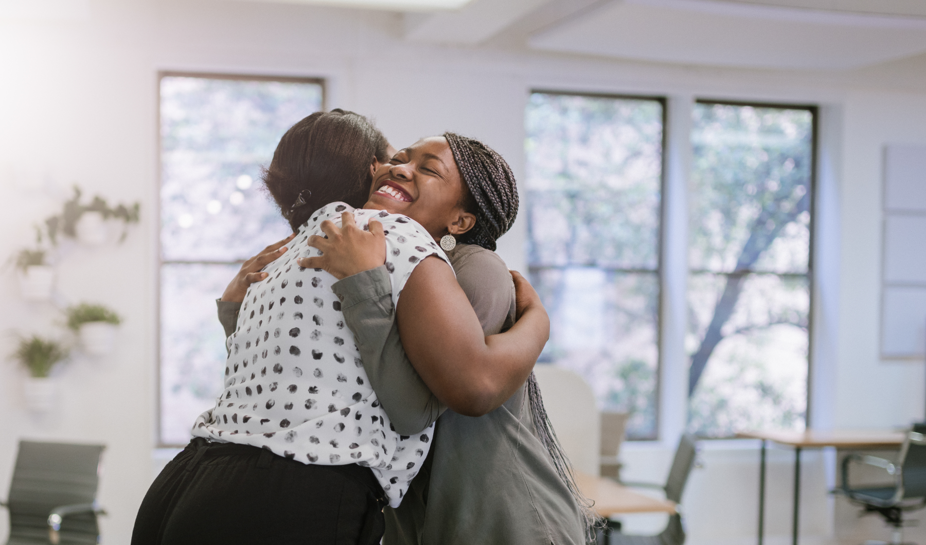 two-women-hugging_250449925