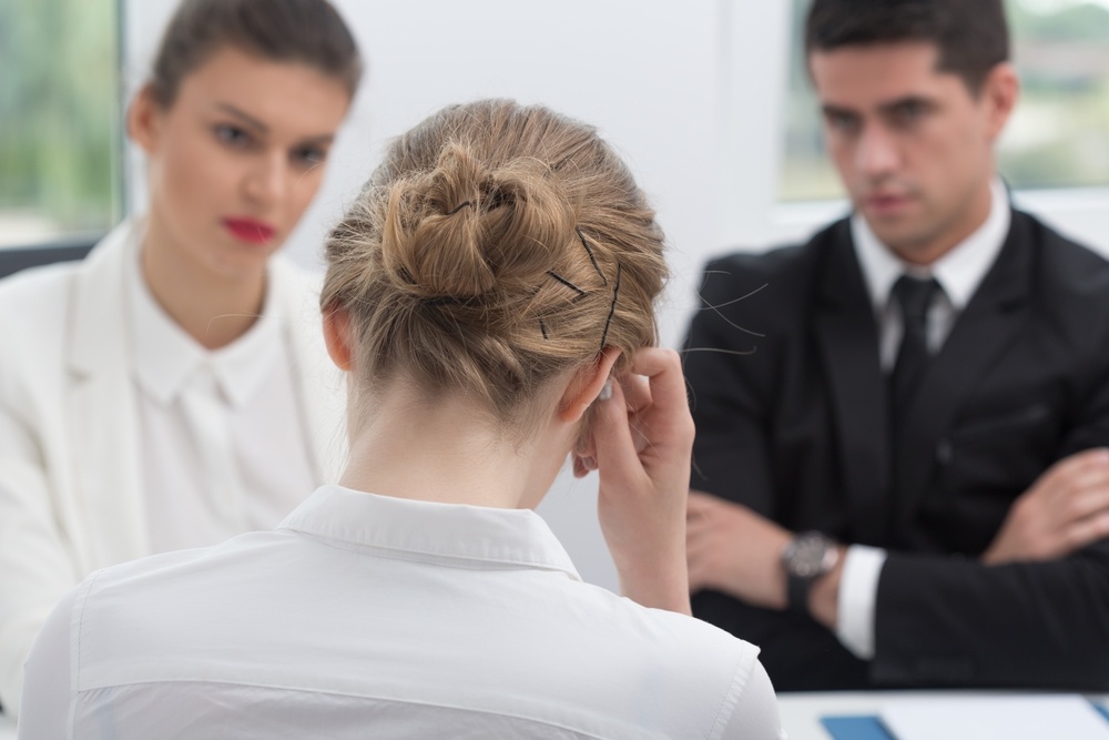 Image of personnel managers during interview with female candidate